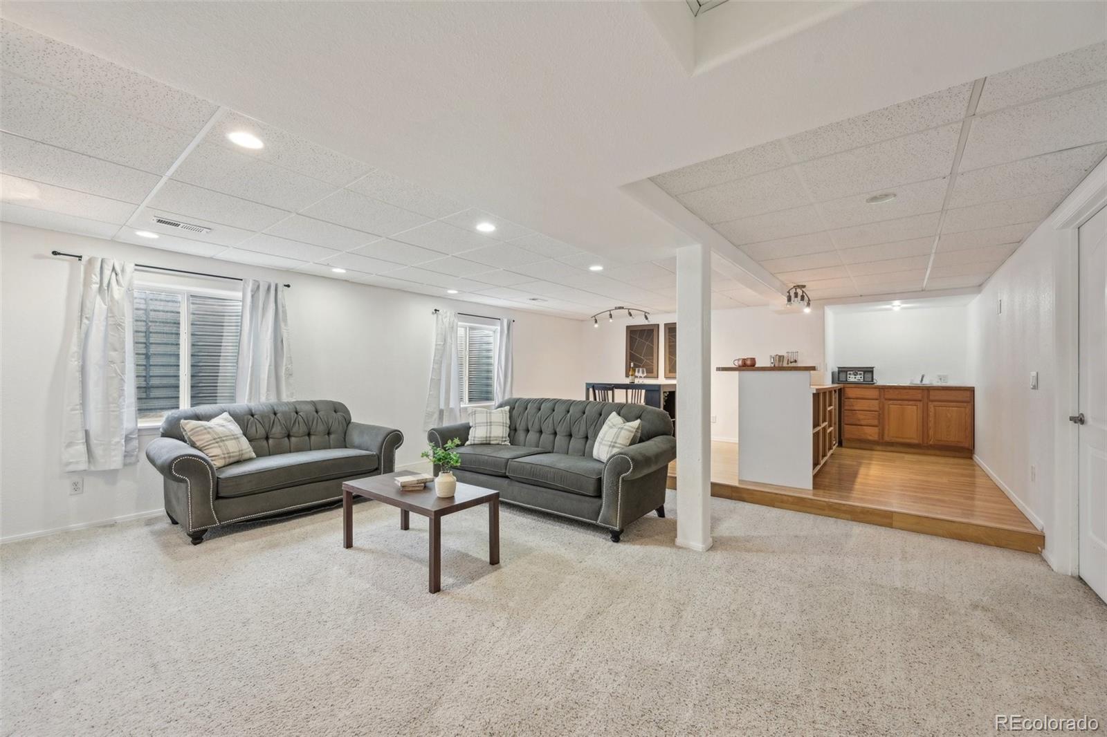 591 Rio Rancho Way Brighton, CO 80601 - Photo 36 of 47 a living room with furniture and a large window