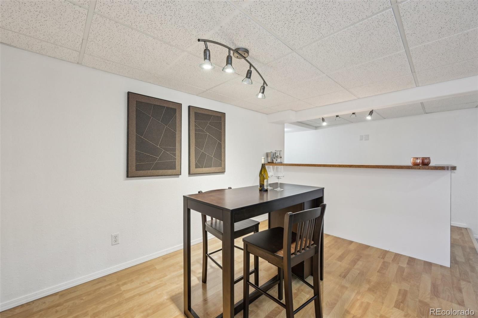 591 Rio Rancho Way Brighton, CO 80601 - Photo 38 of 47 a view of a kitchen with a table and chairs