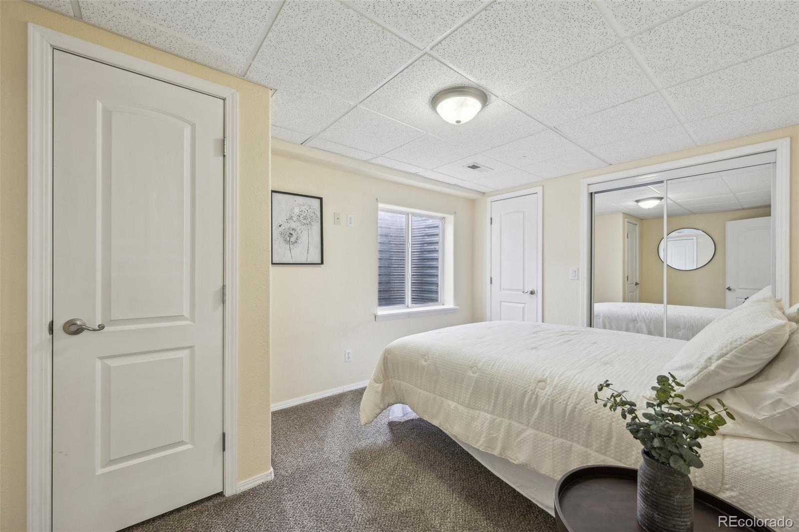 591 Rio Rancho Way Brighton, CO 80601 - Photo 43 of 47 a bedroom with a bed and window