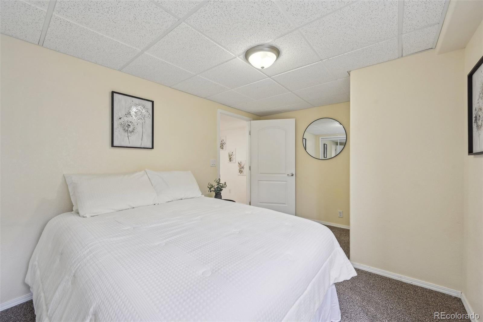 591 Rio Rancho Way Brighton, CO 80601 - Photo 45 of 47 a bedroom with a bed and a window