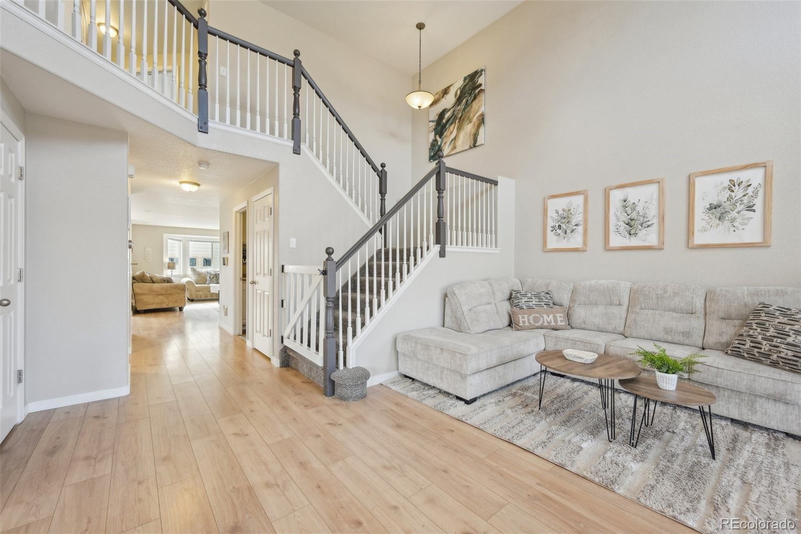 591 Rio Rancho Way Brighton, CO 80601 - Photo 5 of 47 a living room with furniture and a table