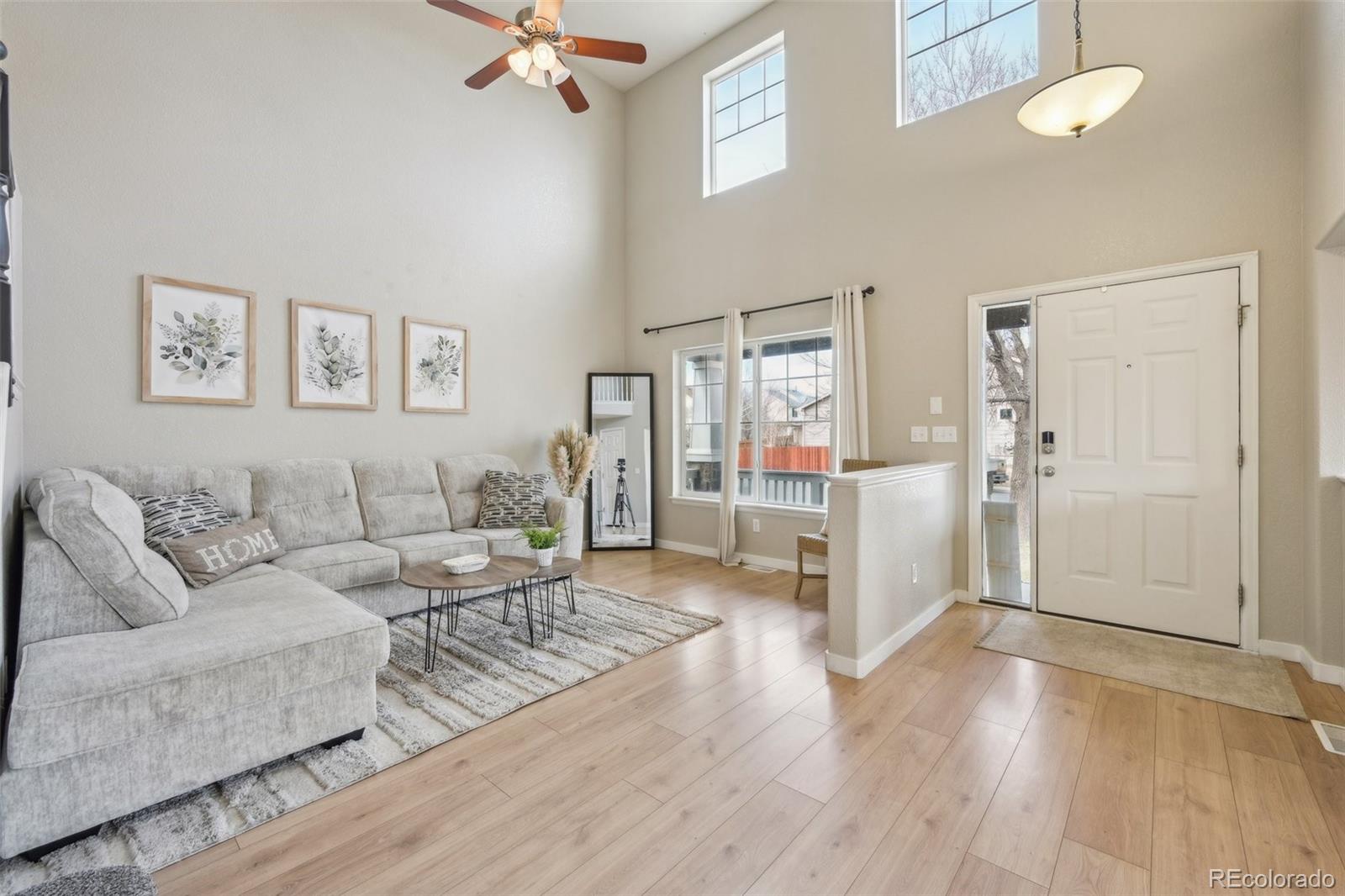 591 Rio Rancho Way Brighton, CO 80601 - Photo 6 of 47 a living room with furniture and a wooden floor