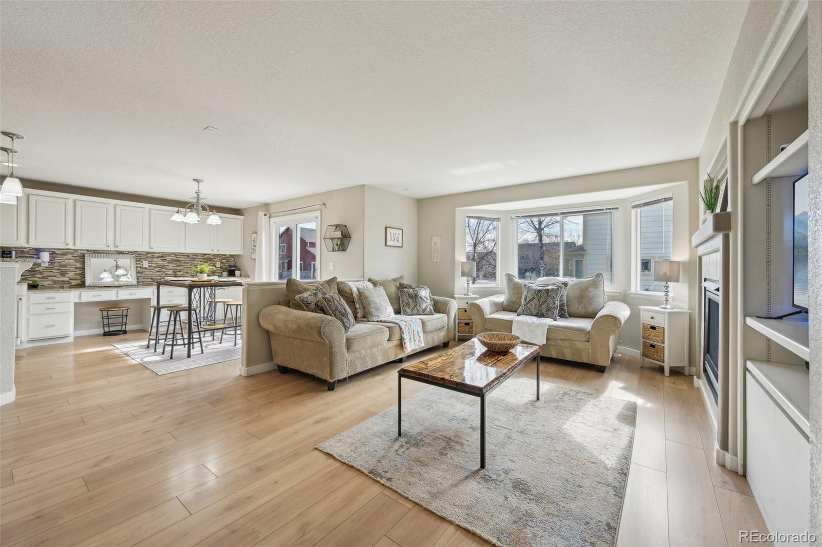 591 Rio Rancho Way Brighton, CO 80601 - Photo 9 of 47 a living room with furniture and a large window