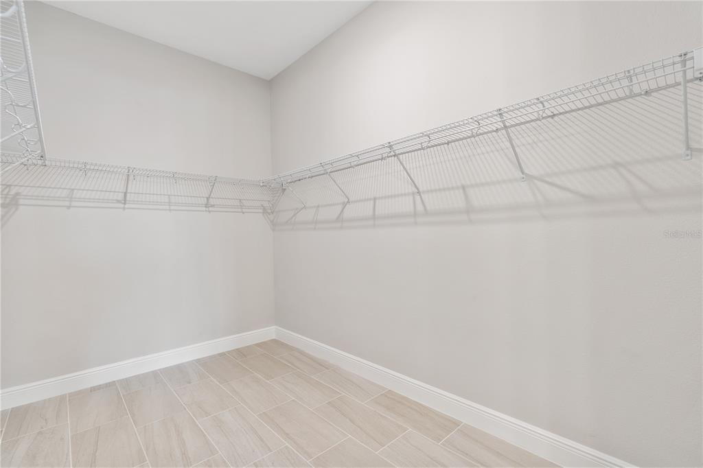 7851 Stoney Bay Loop Kissimmee, FL 34747 - Photo 15 of 33 a view of a room with racks on the wall