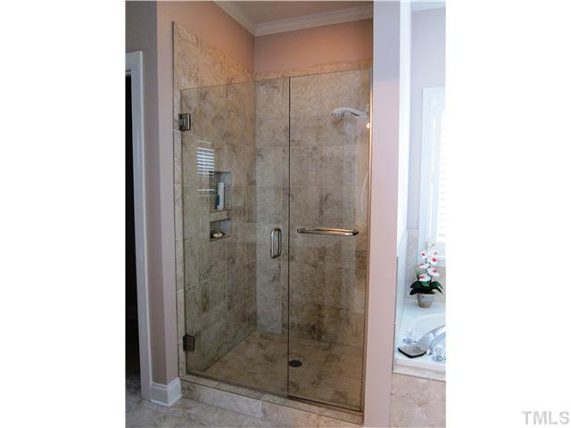 2000 Wheelerbrook Court Raleigh, NC 27603 - Photo 10 of 12 Remodeled Shower has all new tile, niches for soap and shampoo and a beautiful frameless shower door. Master Bath/Spa