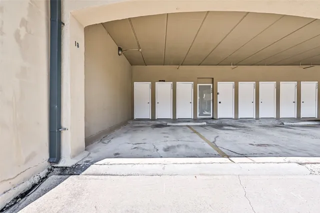 a view of a hall with wooden floor