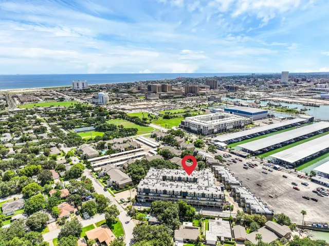 an aerial view of residential houses with outdoor space