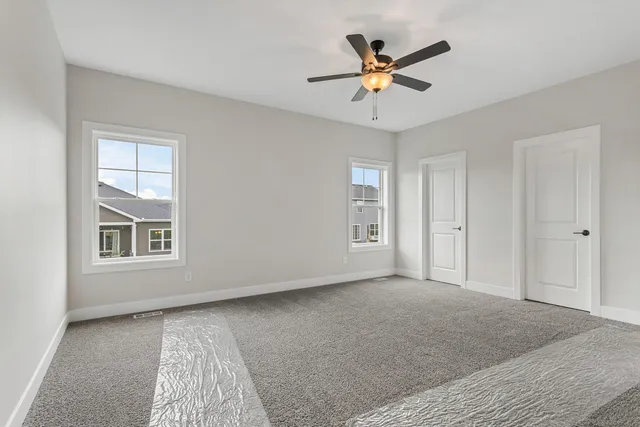 a view of livingroom with hardwood floor and ceiling fan