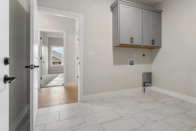 a view of a hallway with closet and mirror