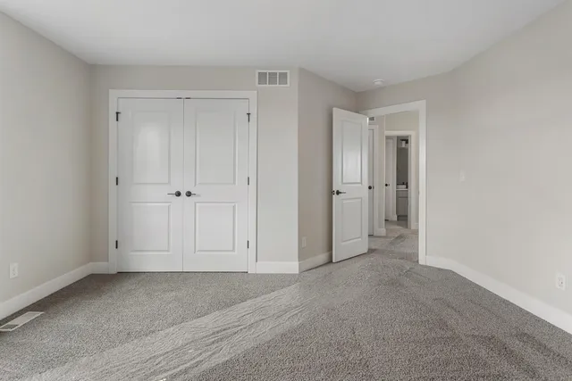 a bathroom with a double vanity sink a mirror and a shower