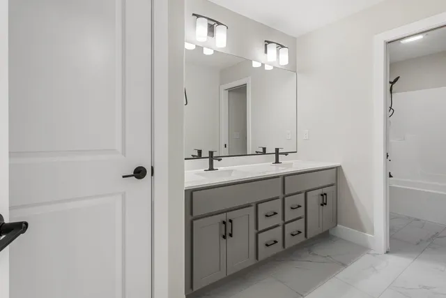 a bathroom with a toilet and a bath tub