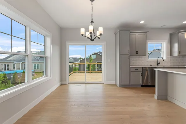 a view of a kitchen with a sink and a window