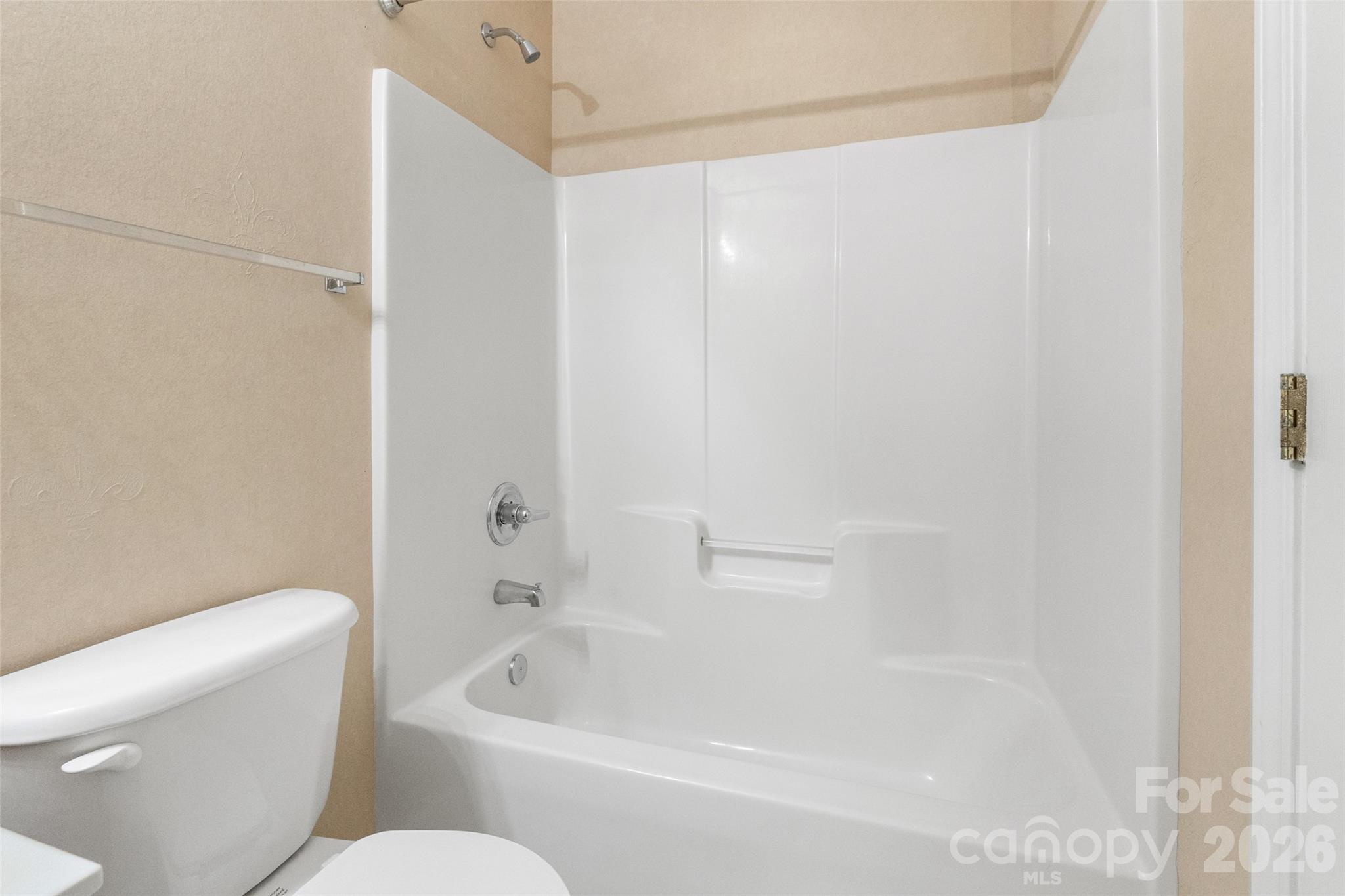 104 Rock Ridge Lane Mount Holly, NC 28120 - Photo 40 of 48 a bathroom with a bathtub and a toilet