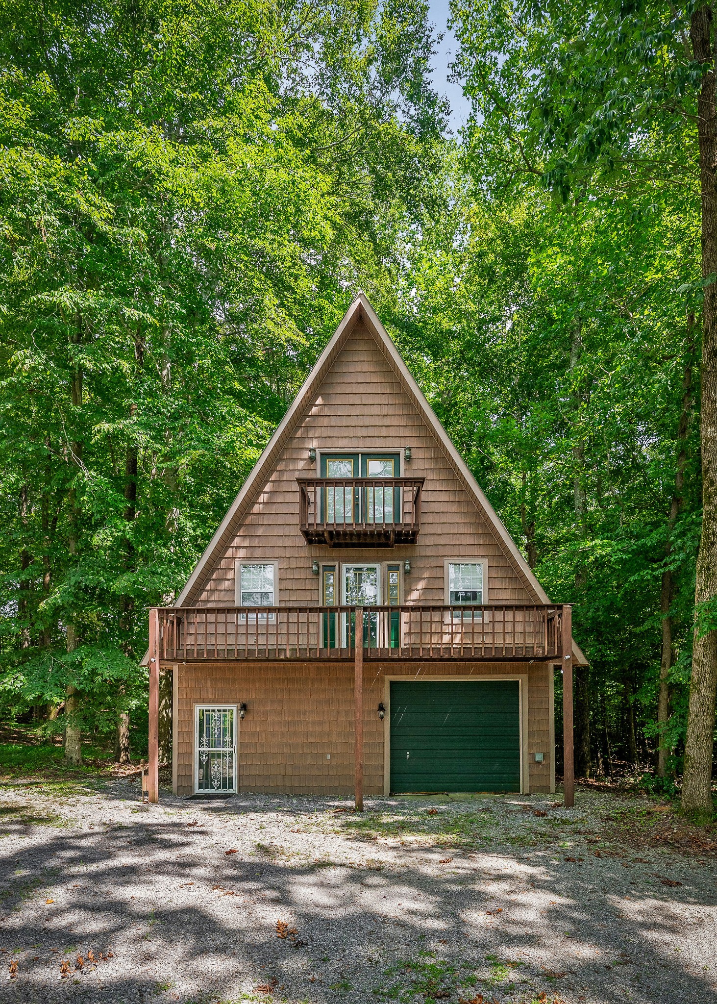 308 Cosby Parris Road Byrdstown, TN 38549 - Photo 11 of 32 a view of a house with a yard plants and large tree
