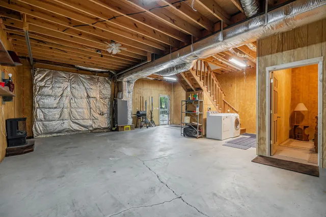 a view of an empty room with stairs
