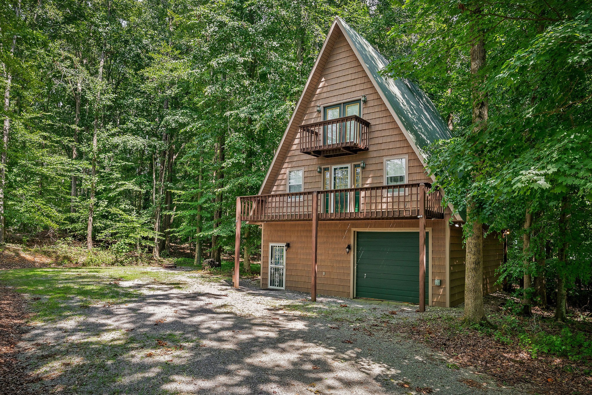 308 Cosby Parris Road Byrdstown, TN 38549 - Photo 10 of 32 a front view of a house with a garden