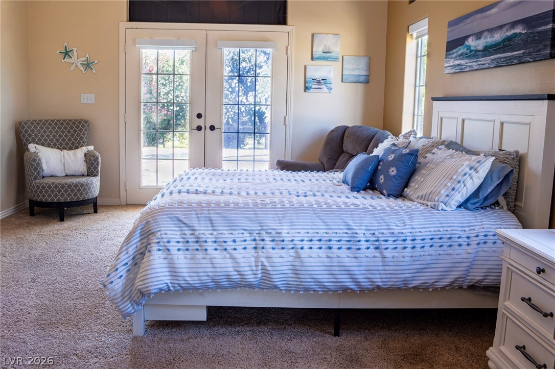 2775 Taylor Street Logandale, NV 89021 - Photo 5 of 41 This serene bedroom offers a tranquil retreat with ample natural light.