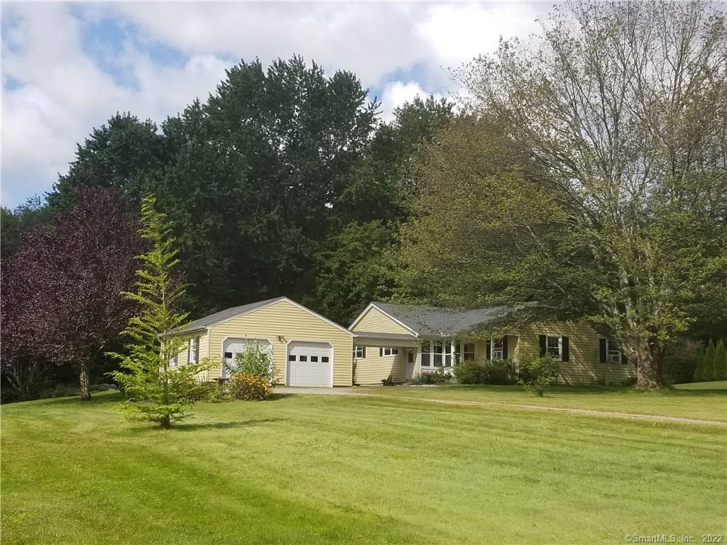 239 Norfolk Road Litchfield, CT 06759 - Photo 1 of 1 a front view of a house with a garden