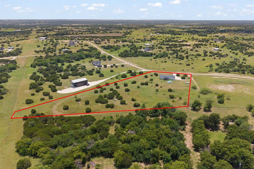 1031 Augustus Court Rio Vista, TX 76093 - Photo 29 of 30 Expansive property featuring a single-story residence and a detached barn-style structure