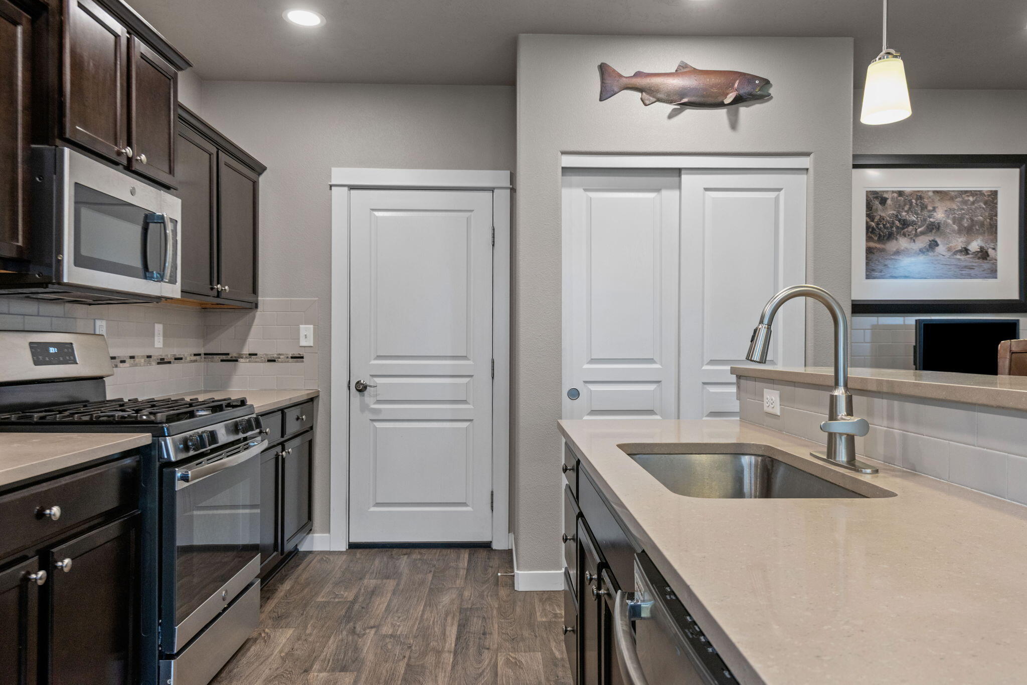 715 Brooks Camp Road Sisters, OR 97759 - Photo 8 of 25 a kitchen with stainless steel appliances granite countertop a sink stove and refrigerator