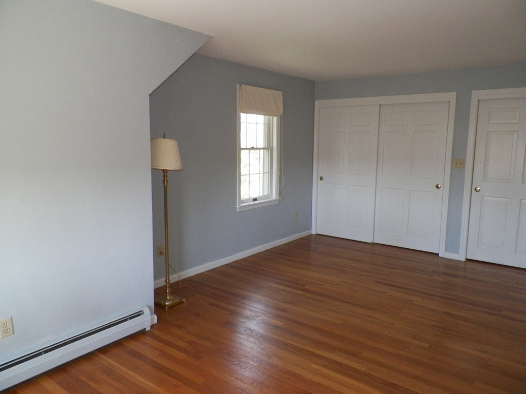 7 Homestead Road Bourne, MA 02562 - Photo 18 of 26 an empty room with wooden floor and window