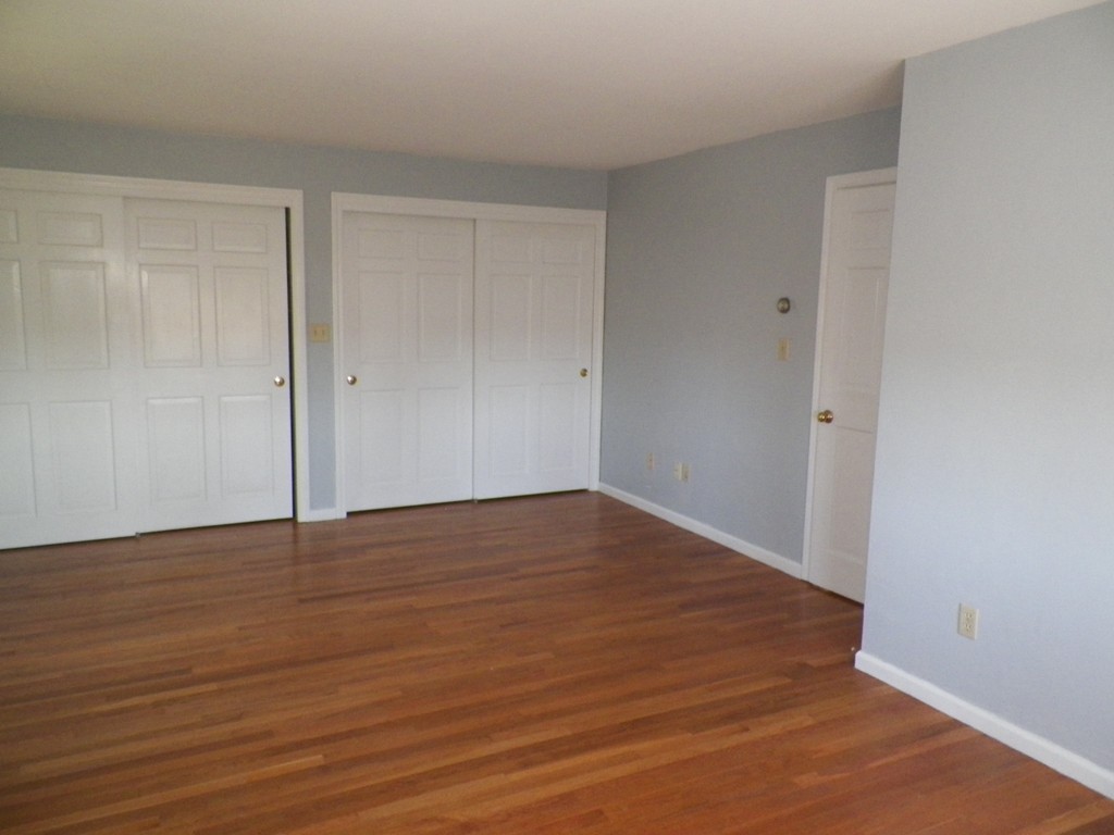7 Homestead Road Bourne, MA 02562 - Photo 19 of 26 a view of an empty room with wooden floor