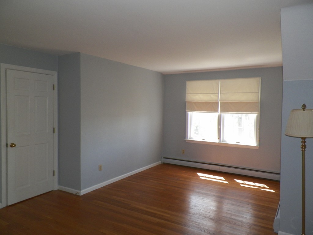 7 Homestead Road Bourne, MA 02562 - Photo 20 of 26 an empty room with wooden floor and windows