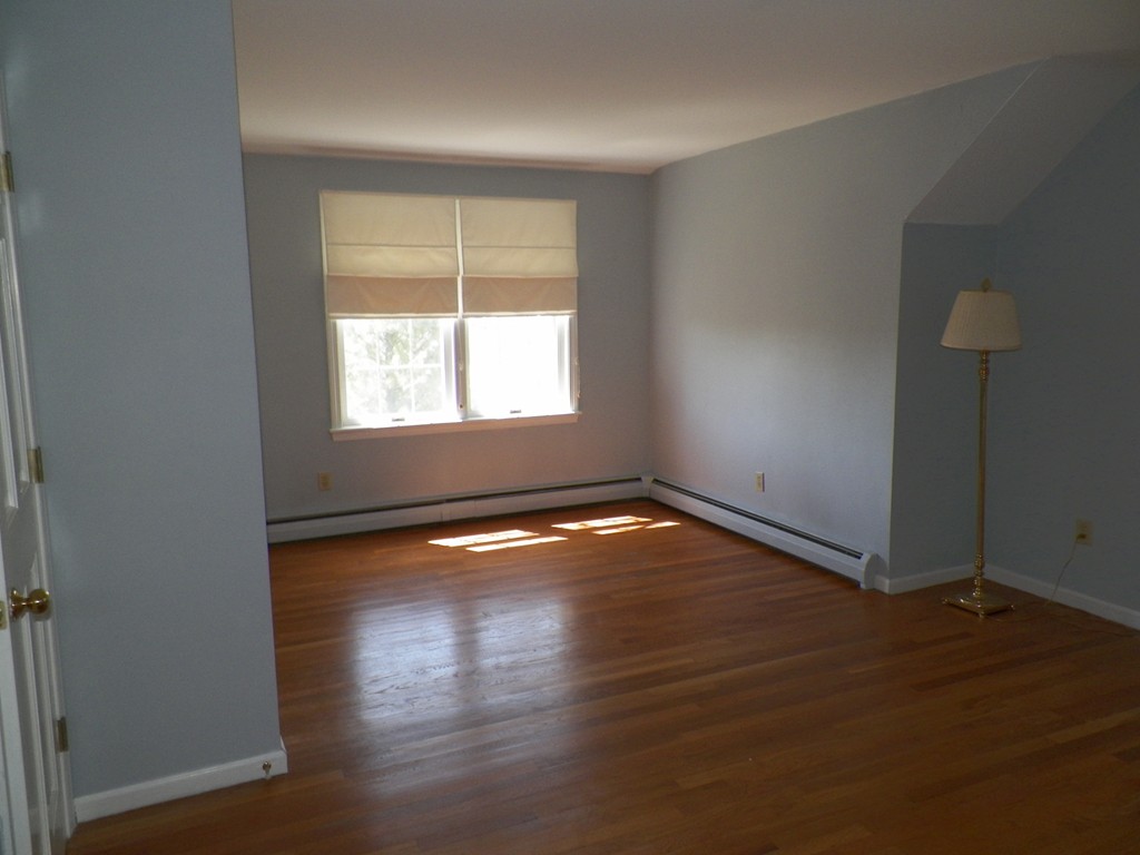 7 Homestead Road Bourne, MA 02562 - Photo 21 of 26 an empty room with wooden floor and windows