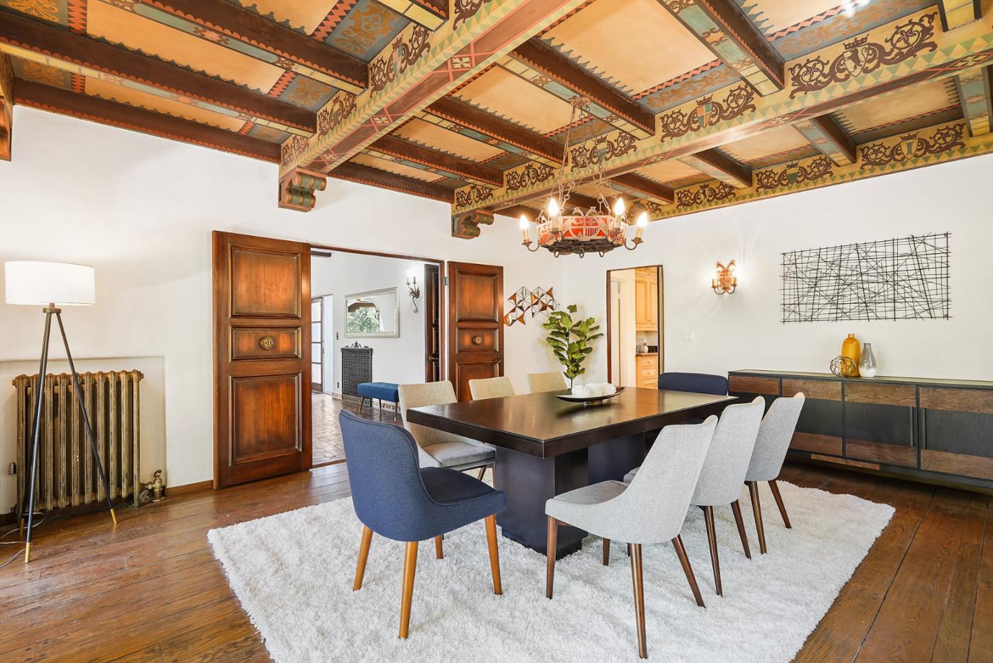 401 Parrott Drive San Mateo, CA 94402 - Photo 17 of 68 a dining room with furniture a chandelier and wooden floor
