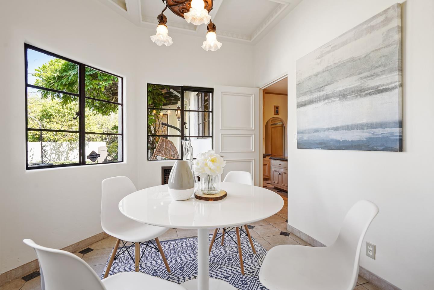 401 Parrott Drive San Mateo, CA 94402 - Photo 26 of 68 a dining room with furniture a window and wooden floor