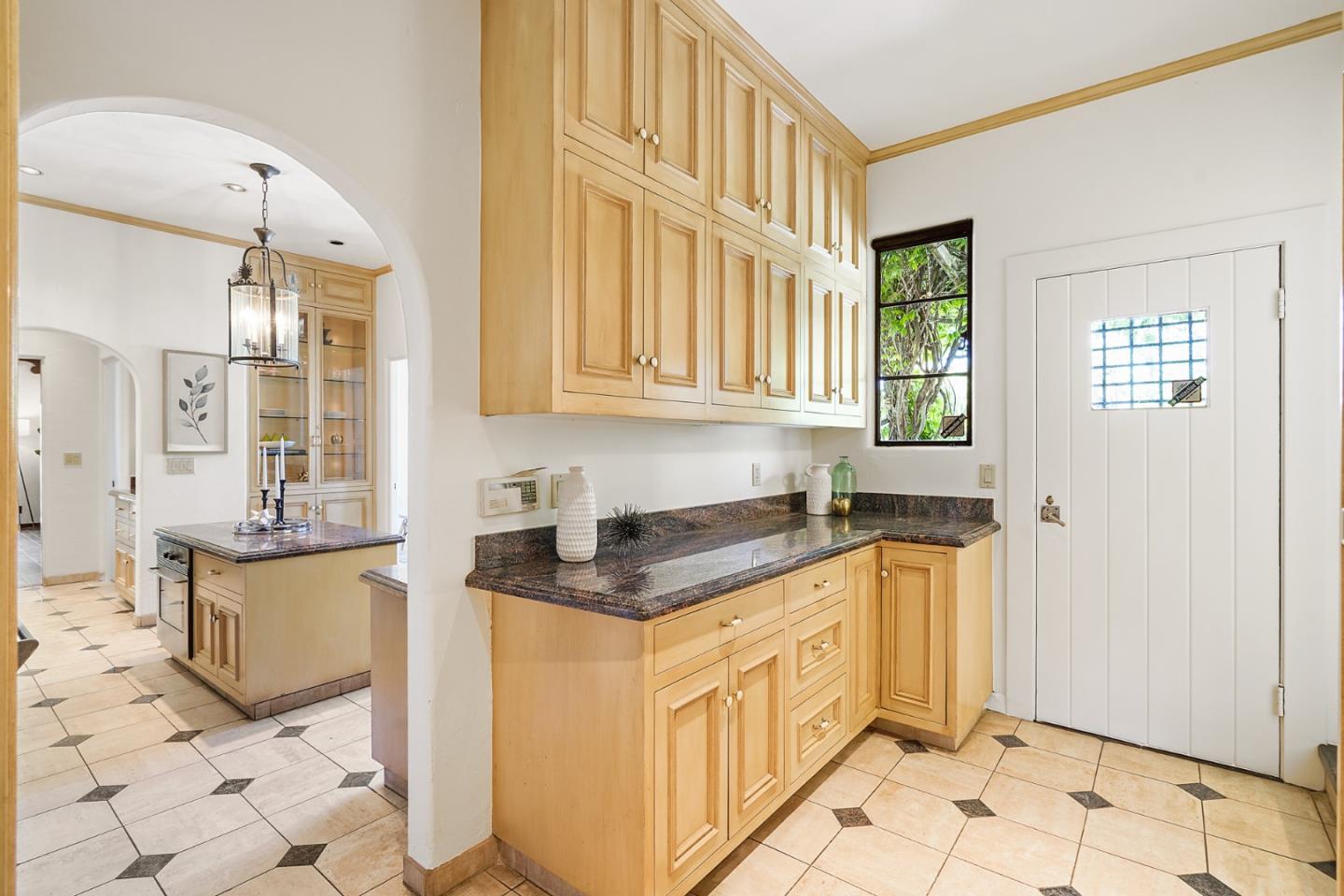 401 Parrott Drive San Mateo, CA 94402 - Photo 27 of 68 a kitchen with stainless steel appliances granite countertop a stove a sink and a refrigerator