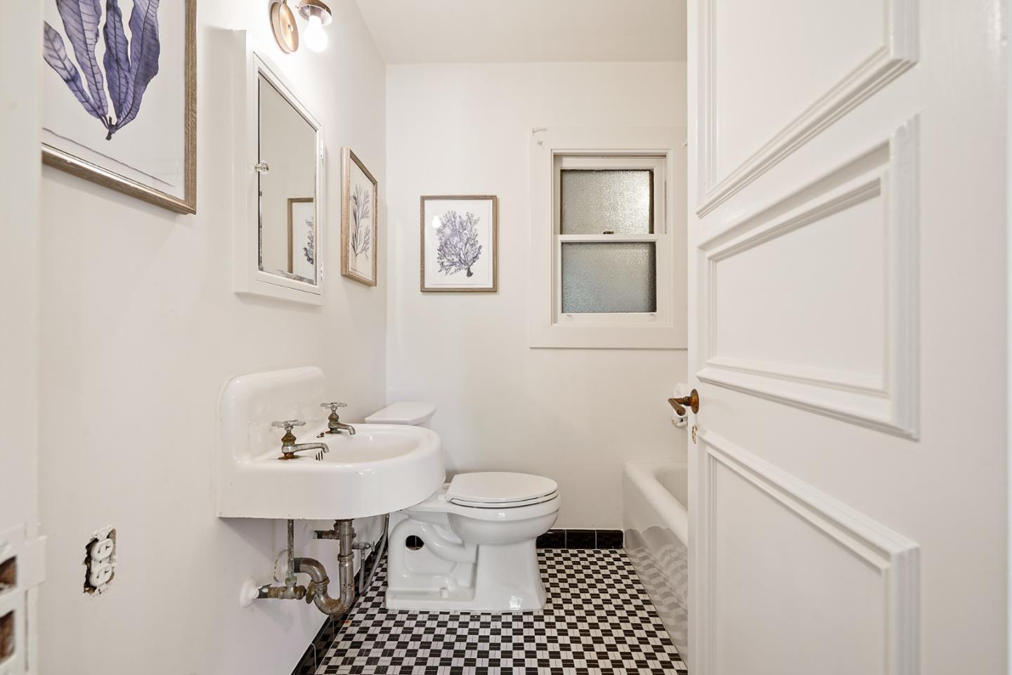401 Parrott Drive San Mateo, CA 94402 - Photo 30 of 68 a bathroom with a sink toilet and a mirror