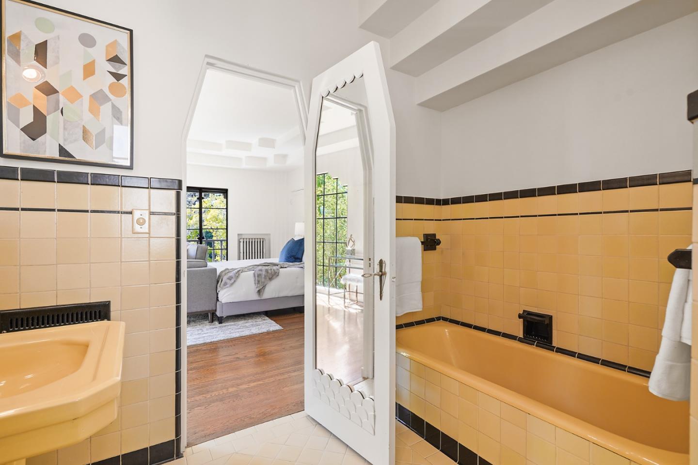 401 Parrott Drive San Mateo, CA 94402 - Photo 43 of 68 a bathroom with a tub and shower