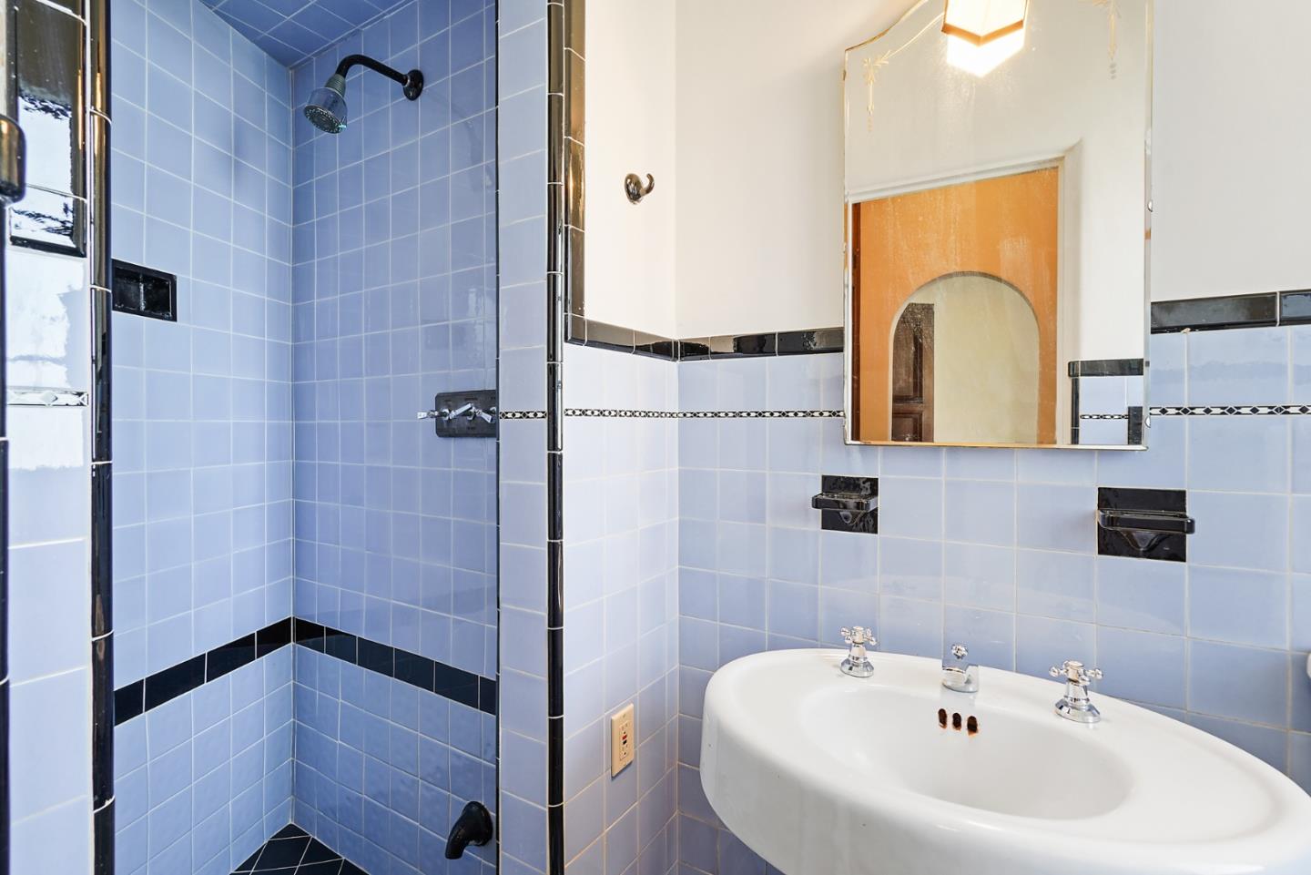 401 Parrott Drive San Mateo, CA 94402 - Photo 48 of 68 a bathroom with a sink and a shower