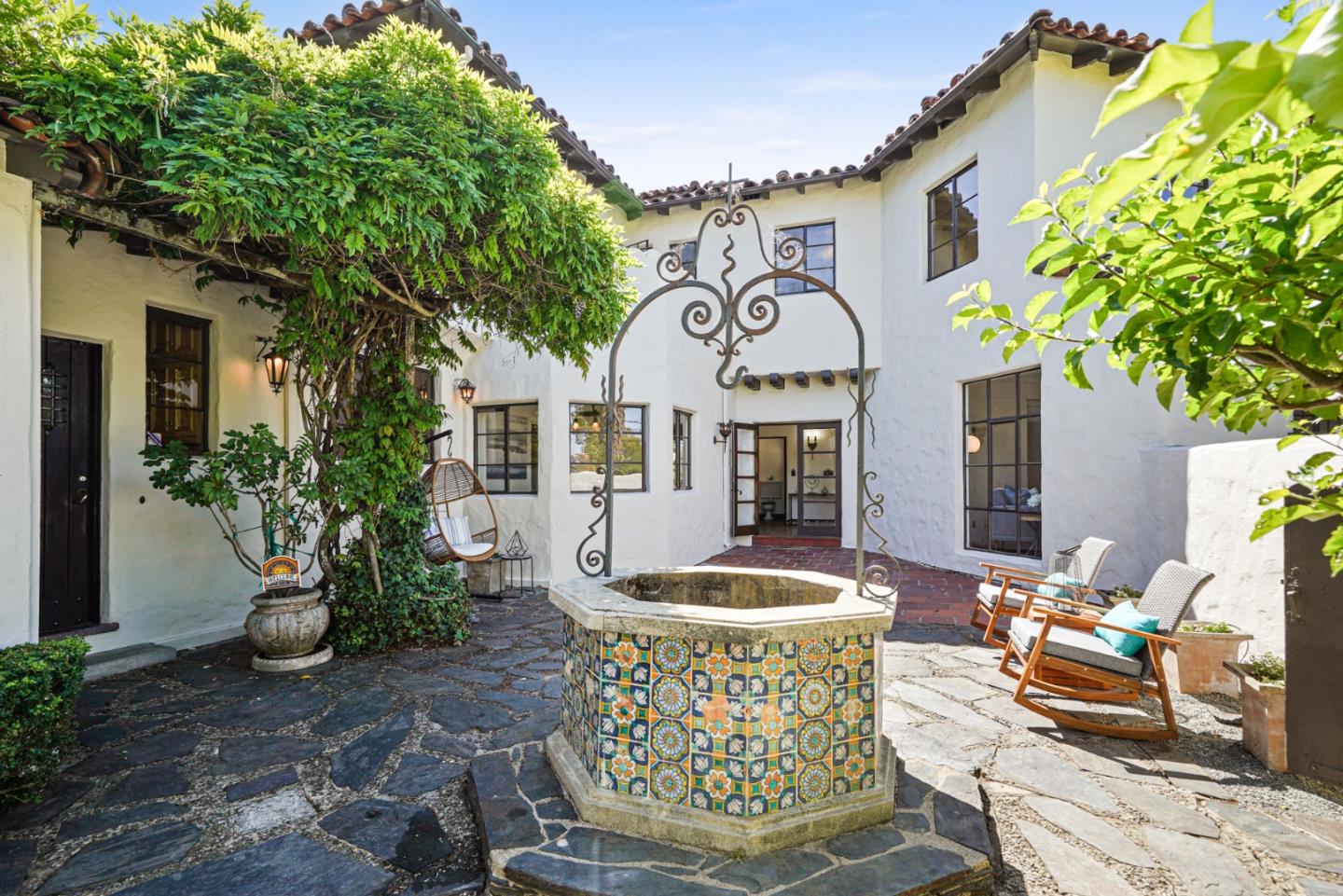 401 Parrott Drive San Mateo, CA 94402 - Photo 54 of 68 a front view of a house with garden and fountain