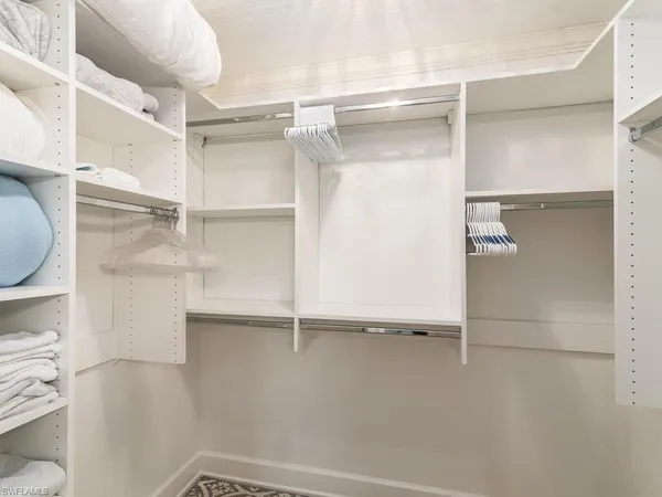 a view of an empty walk in closet