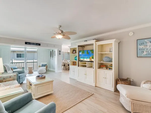 a living room with furniture and white walls