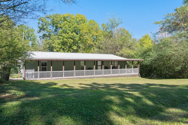a view of a house with a big yard