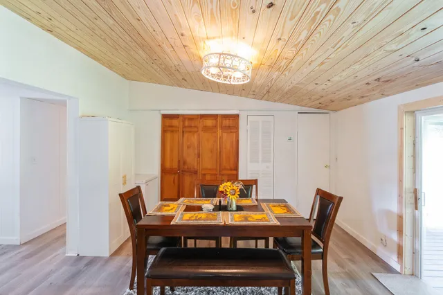 a view of a dining room with furniture and window