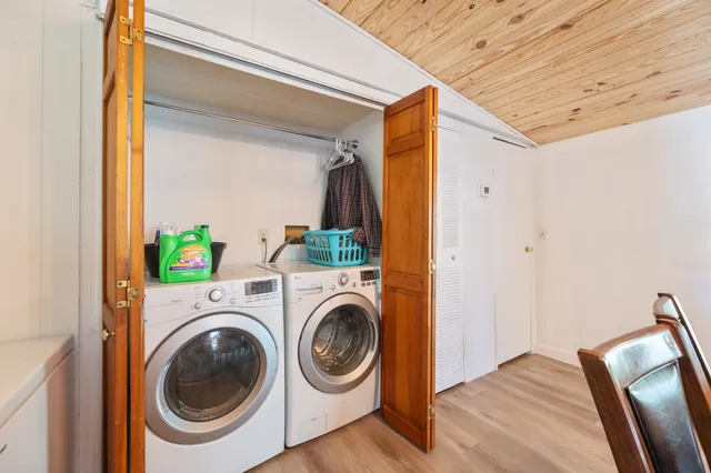 a view of a hallway with washer and dryer