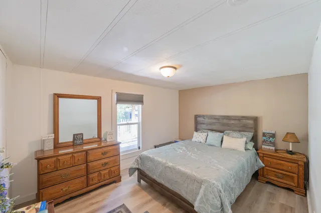 a bedroom with a bed and a dresser