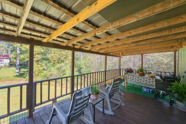 a view of a patio with wooden floor