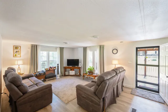 a living room with furniture or couch and a flat screen tv