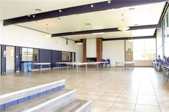 a view of a swimming pool and outdoor seating