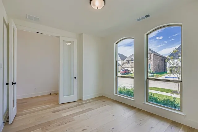 a view of an entryway with wooden floor