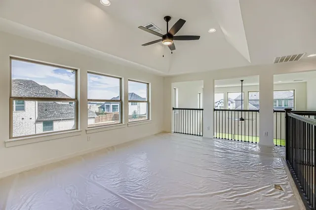 a view of an empty room with a balcony