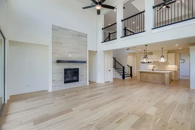 a view of a kitchen with a sink and a fireplace