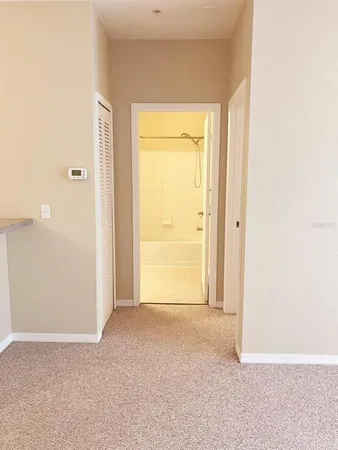 a view of an empty room with a window