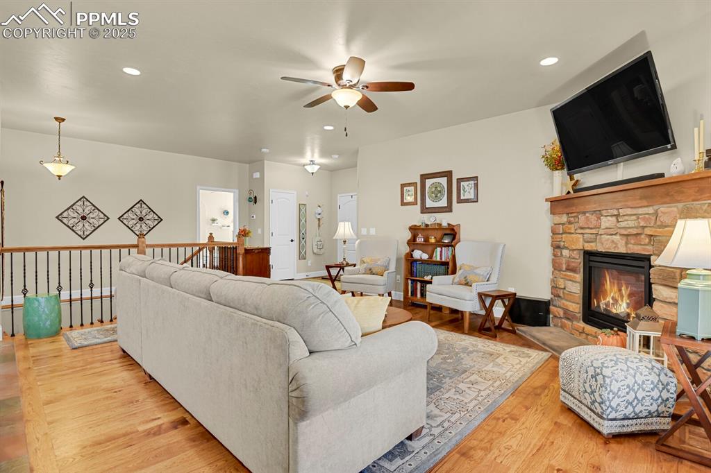 13015 Cake Bread Heights Colorado Springs, CO 80921 - Photo 14 of 45 a living room with furniture and a flat screen tv