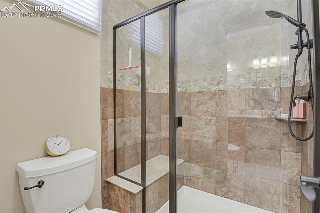 13015 Cake Bread Heights Colorado Springs, CO 80921 - Photo 20 of 45 a bathroom with a shower and toilet